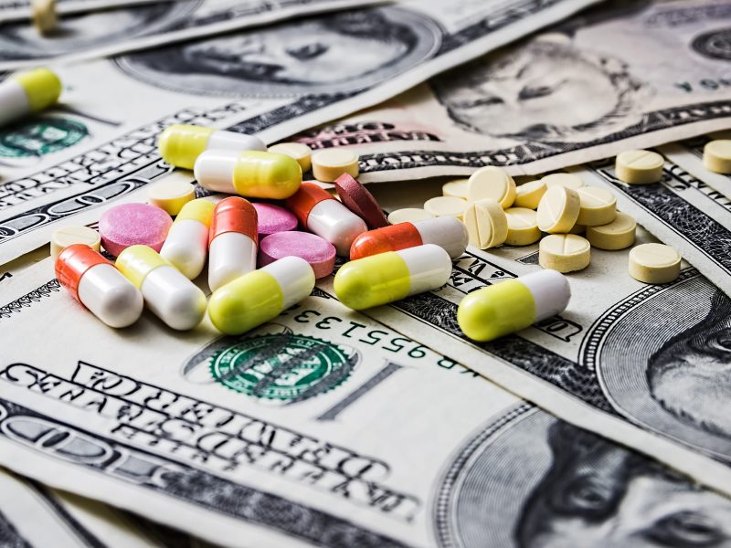 Expensive medicine. Medical insurance. Drug addiction. Money and pills. Drugs.